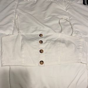 White top, ties in back